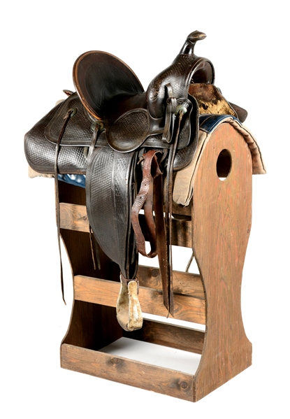 ANTIQUE J.H. WILSON WESTERN SADDLE WITH STAND. 