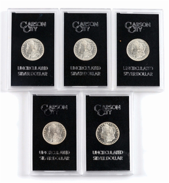 LOT OF 5: CARSON CITY UNCIRCULATED SILVER DOLLARS IN CASES.