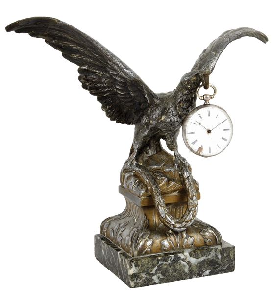 METAL EAGLE STATUE HOLDING A POCKET WATCH ON A MARBLE BASE.