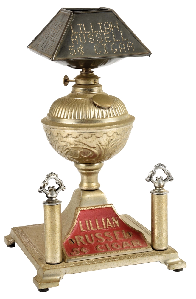 LILLIAN RUSSELL CIGAR LIGHTER WITH A PUNCHED TIN SHADE.