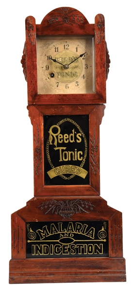 WOODEN AND GLASS REEDS TONIC CLOCK.