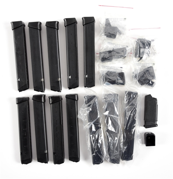 LOT OF VARIOUS GLOCK 9MM MAGAZINES AND GRIP EXTENSIONS. 