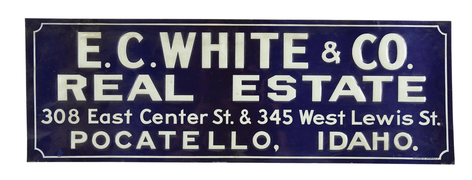 E.C. WHITE & CO. REAL ESTATE EMBOSSED TIN SIGN.