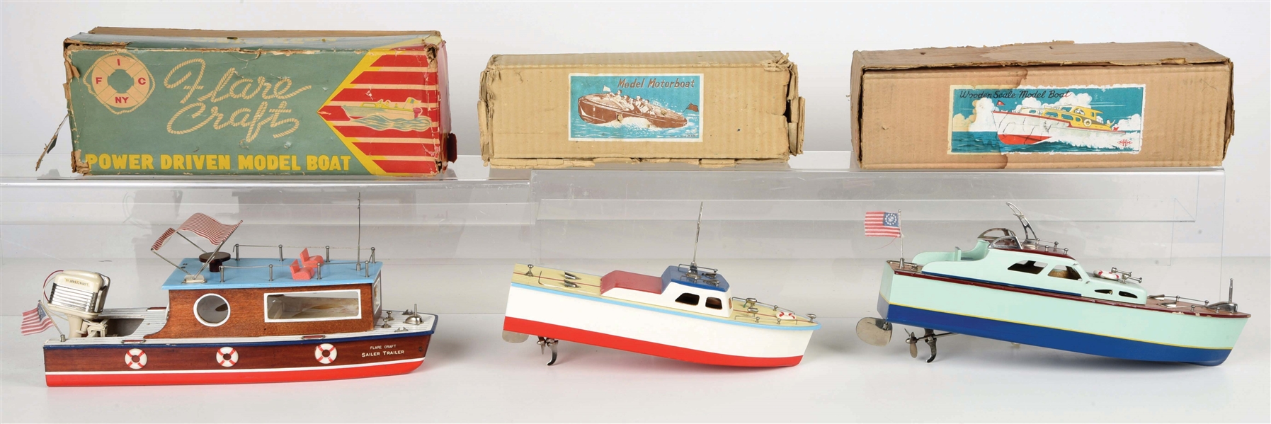 LOT OF 3: JAPANESE BATTERY-OPERATED WOODEN BOAT MODELS IN ORIGINAL BOXES.