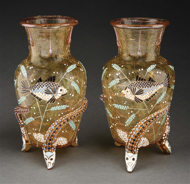PAIR OF MOSER CRACKLED GLASS SERPENT VASES WITH ENAMELED FISH.