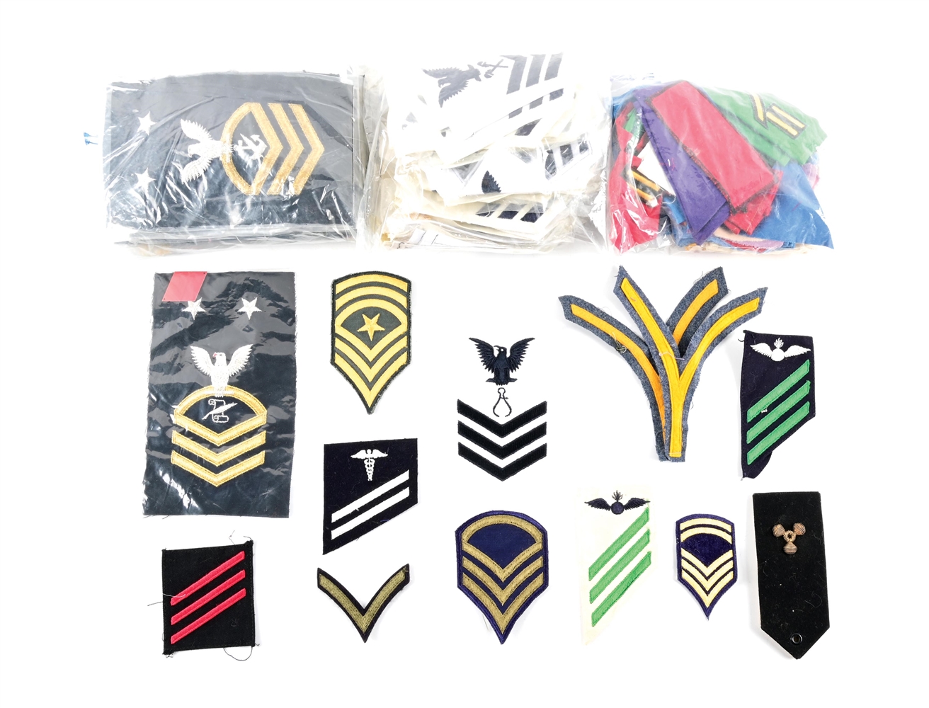 MASSIVE LOT OF US WWII-MODERN RANK INSIGNIA AND PATCHES.