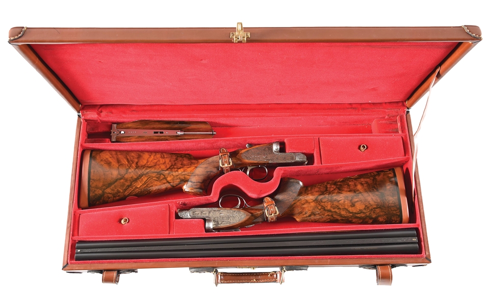 (M) PAIR OF IVO FABBRI SIDELOCK SIDE BY SIDE 12 GAUGE SHOTGUNS WITH ENGRAVED SCENES BY TOMASONI.
