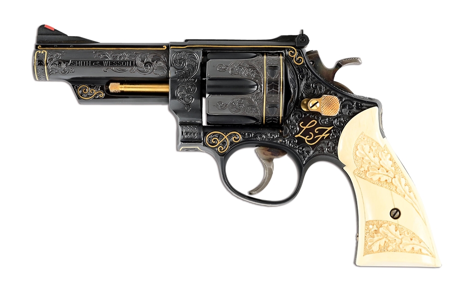 (M) AN ASTOUNDING SMITH & WESSON 29-2 COMMISSIONED BY ELVIS PRESLEY, "THE KING", FOR LAMAR FIKE, HIS CLOSE FRIEND, CONFIDANT, AND MEMBER OF THE MEMPHIS MAFIA, LAVISHLY ENGRAVED AND GOLD EMBELLISHED.