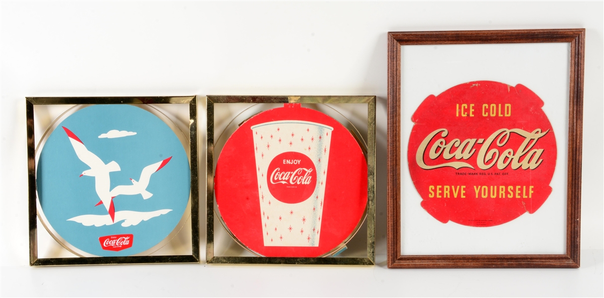 LOT OF 3: 1950S AND 60S FRAMED COCA-COLA ADS.