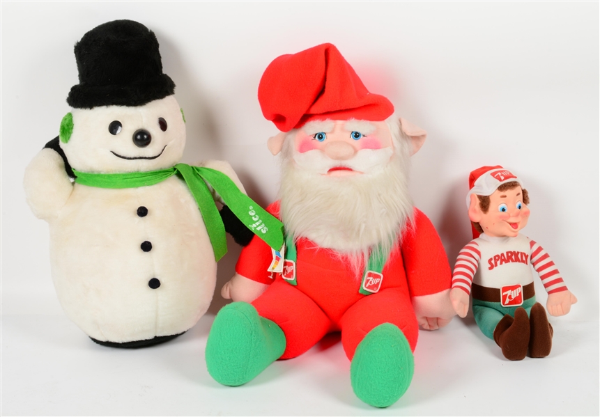 COLLECTION OF THREE CHRISTMAS SODA POP PLUSHES.