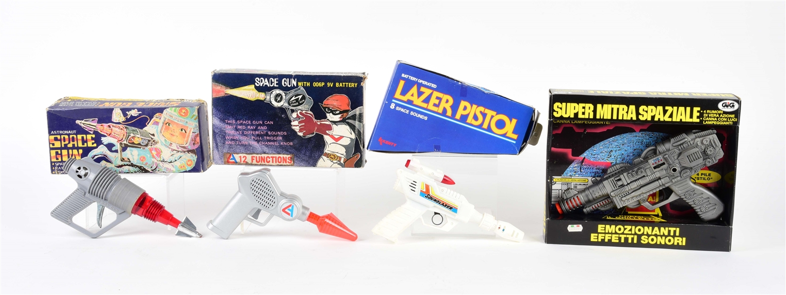 LOT OF 4: BATTERY-OPERATED & FRICTION SPACE PISTOLS IN ORIGINAL BOXES.