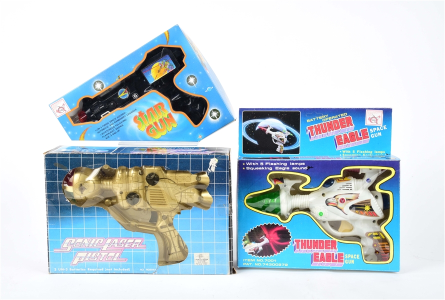 LOT OF 3: FOREIGN-MADE PLASTIC BATTERY-OPERATED SPACE GUNS.