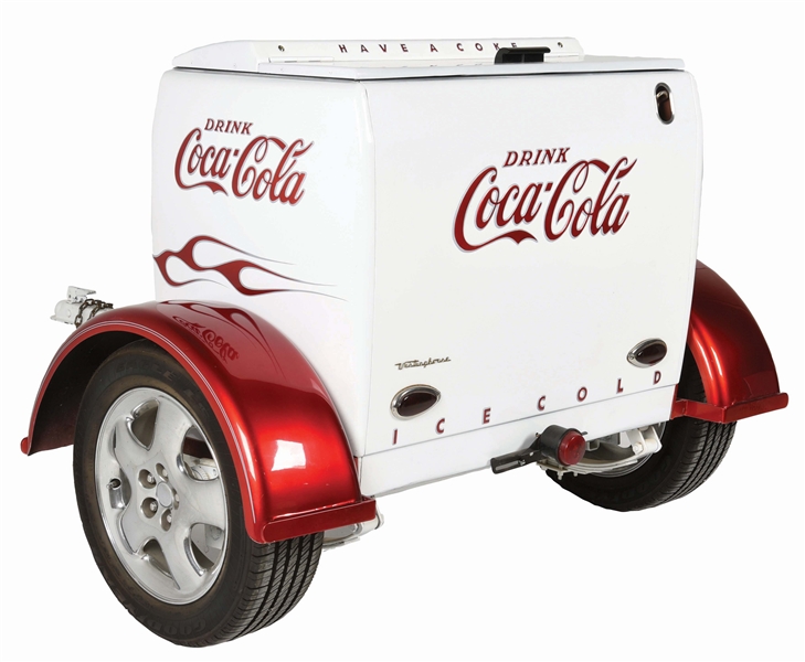 COCA-COLA WESTINGHOUSE COOLER CONNECTED TO A TRAILER HITCH.