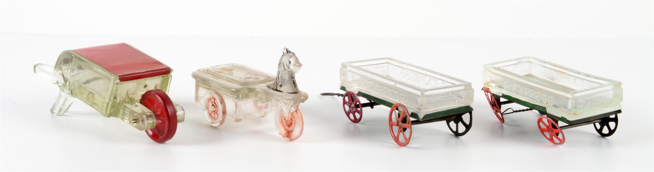 LOT OF 4: VINTAGE GLASS WAGON & WHEELBARROW CANDY CONTAINERS.