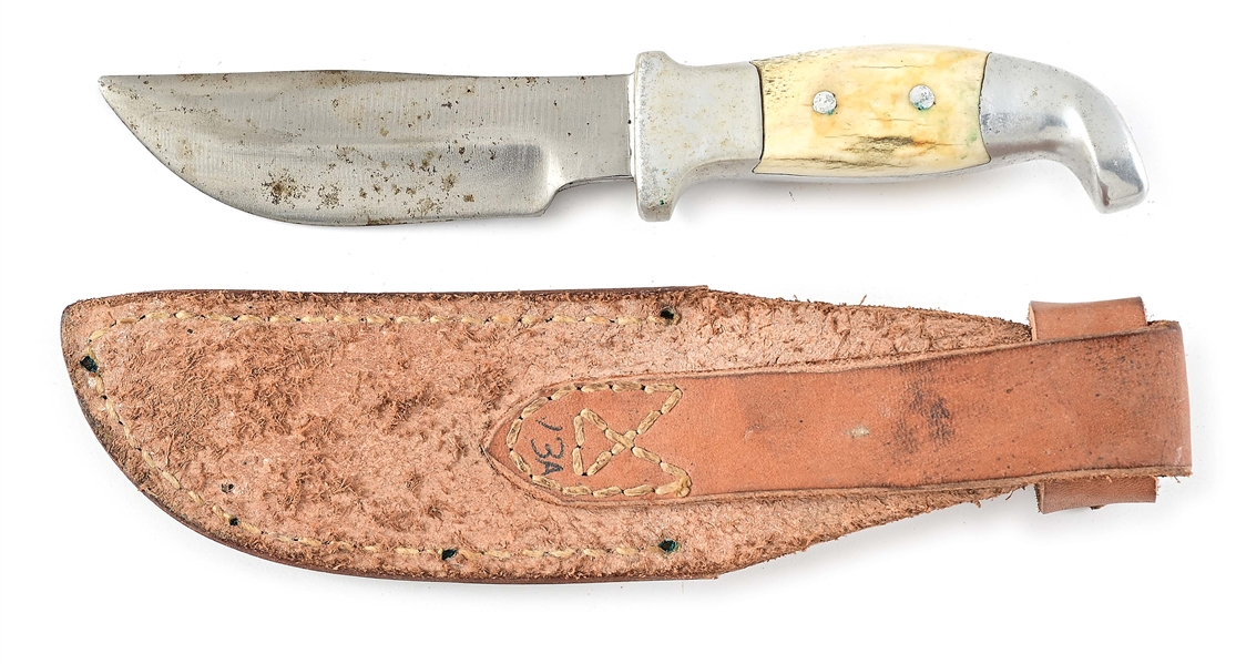 R.H. RUANA FIXED BLADE KNIFE WITH SAMBAR STAG HANDLE IN CORRECT SHEATH.