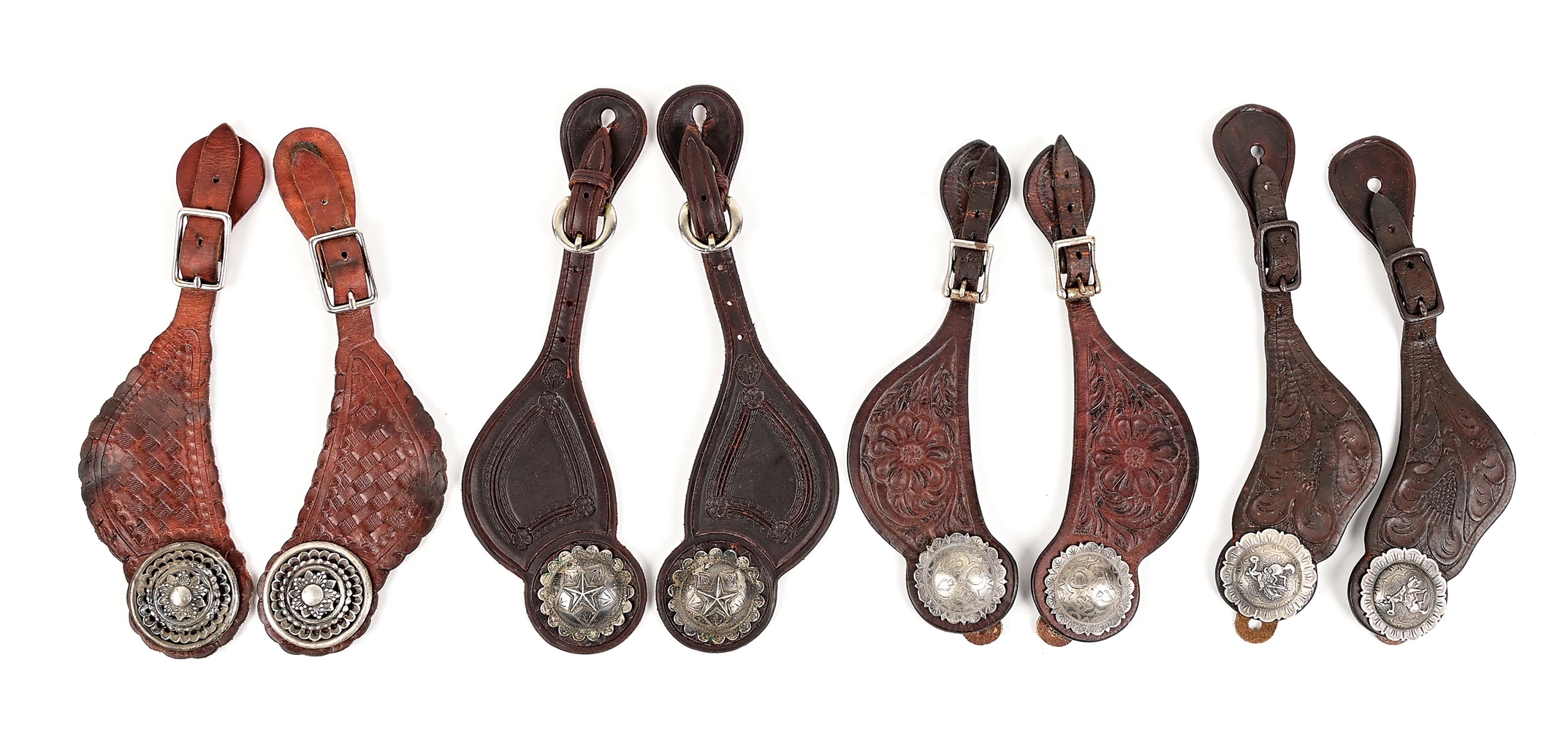 LOT OF 4: ANTIQUE WESTERN SPUR STRAPS WITH SILVER CONCHOS.