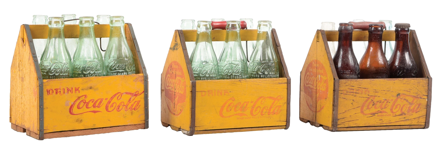 COLLECCTION OF 3 COCA-COLA WOODEN CARRIERS WITH GLASS BOTTLES.