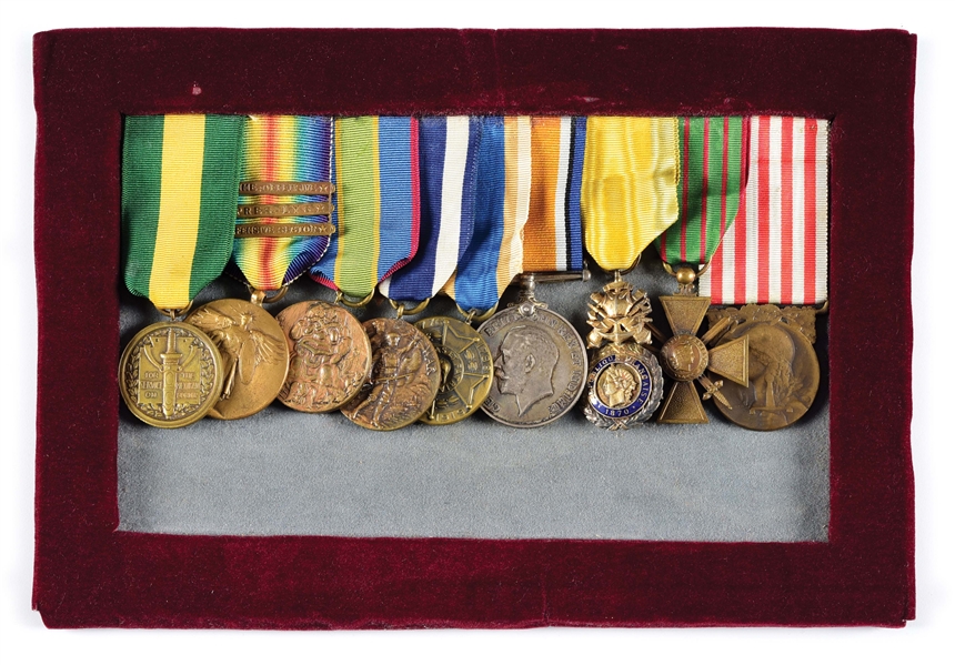 NAMED WWI ERA MEDAL BAR WITH US, BRITISH, AND FRENCH MEDALS.