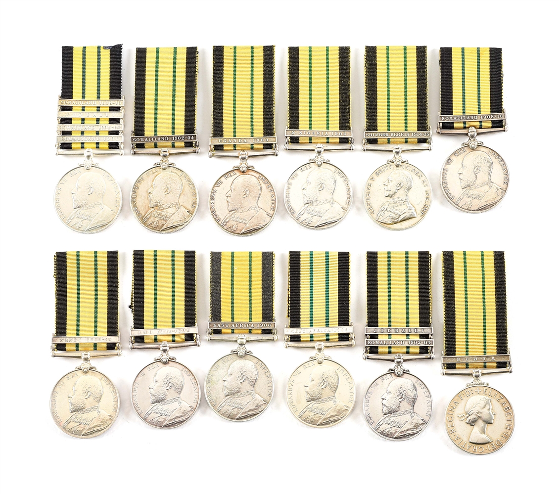 LOT OF 12: NAMED BRITISH AFRICA GENERAL SERVICE MEDALS, MOST WITH CLASPS.