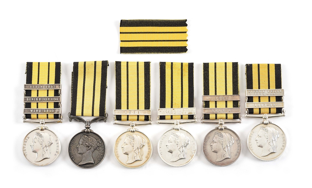 LOT OF 6: NAMED BRITISH EAST AND WEST AFRICA SERVICE MEDALS WITH CLASPS.