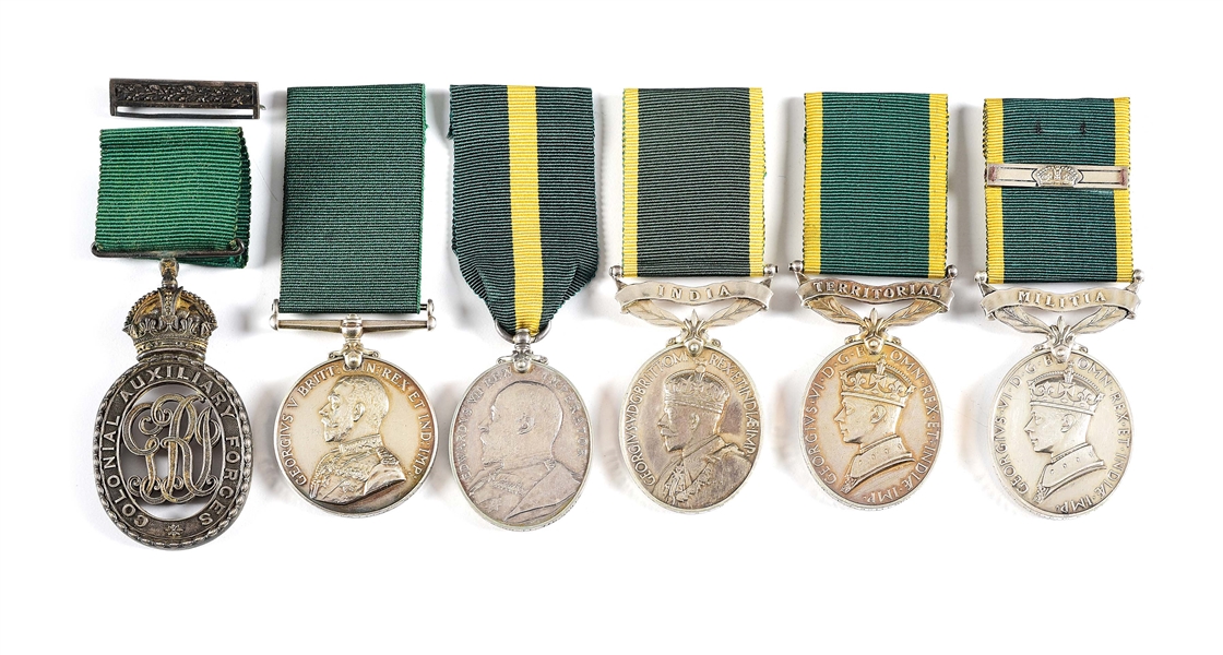 LOT OF 6: 4 BRITISH TERRIRTORIAL EFFICIENCY MEDALS, 1 COLONIAL AUXILIARY FORCES LONG SERVICE MEDAL, AND 1 COLONIAL AUXILIARY FORCES OFFICERS DECORATION, ALL NAMED.