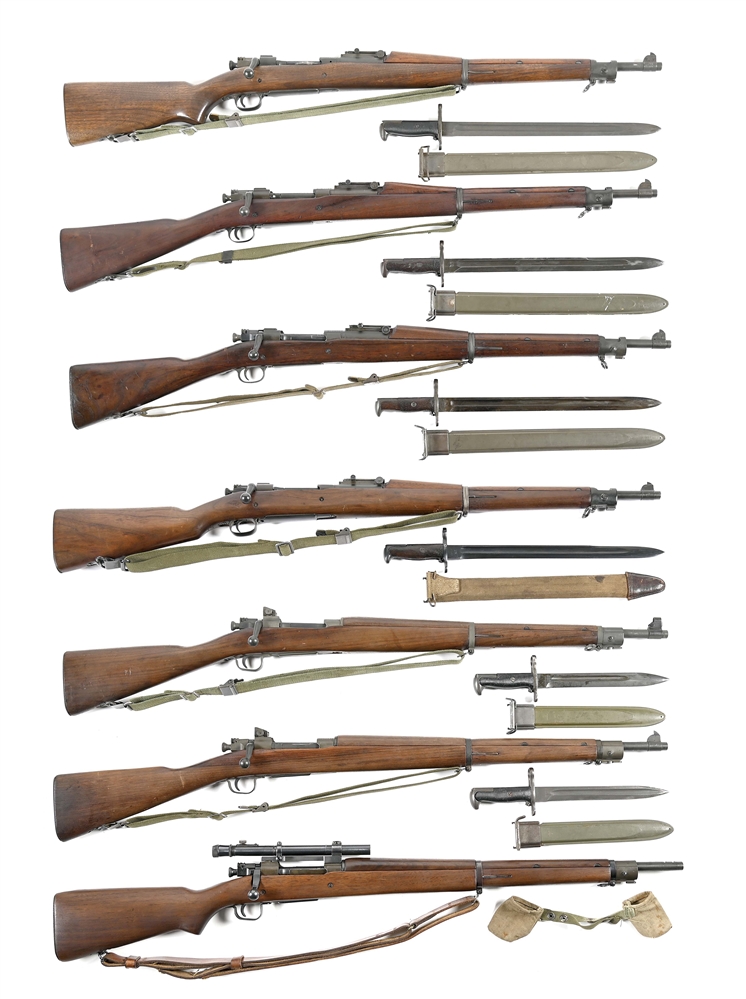 (C) DISPLAY OF 7 REMINGTON US M1903 BOLT ACTION RIFLES.