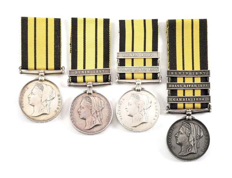 LOT OF 4: BRITISH EAST AND WEST AFRICA SERVICE MEDALS WITH CLASPS NAMED TO ROYAL NAVY.