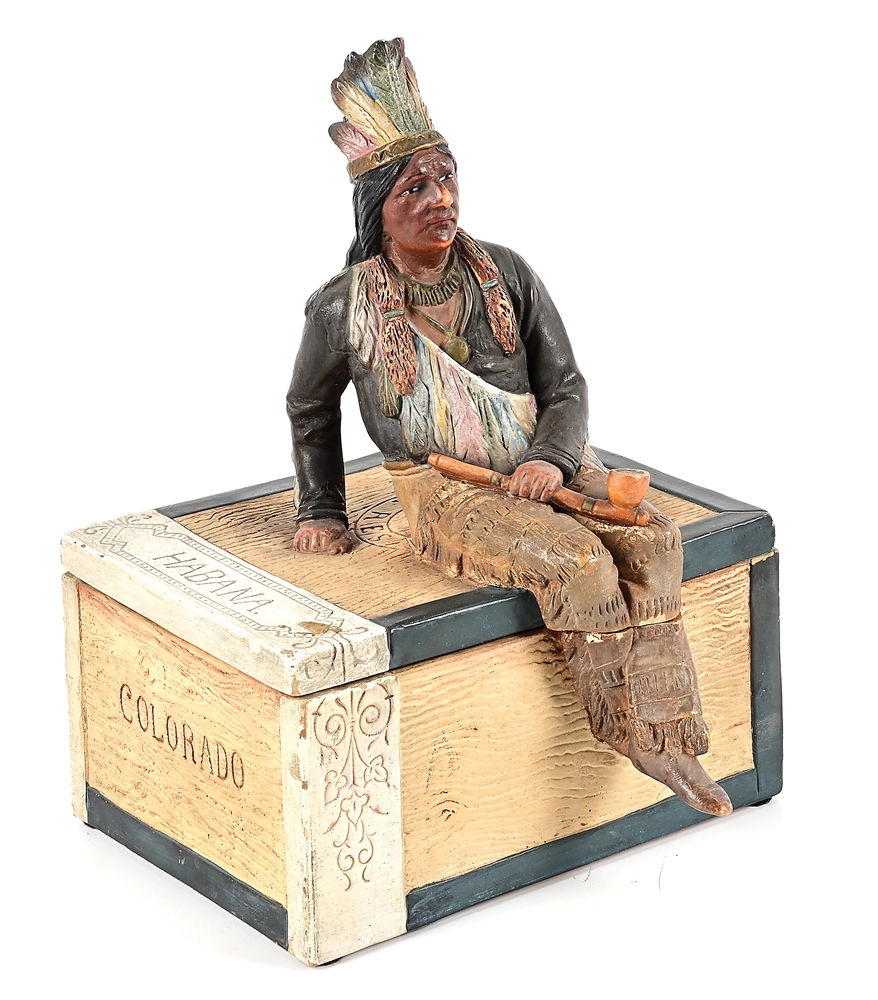 INDIAN SITTING ON BOX TOBACCO HUMIDOR.
