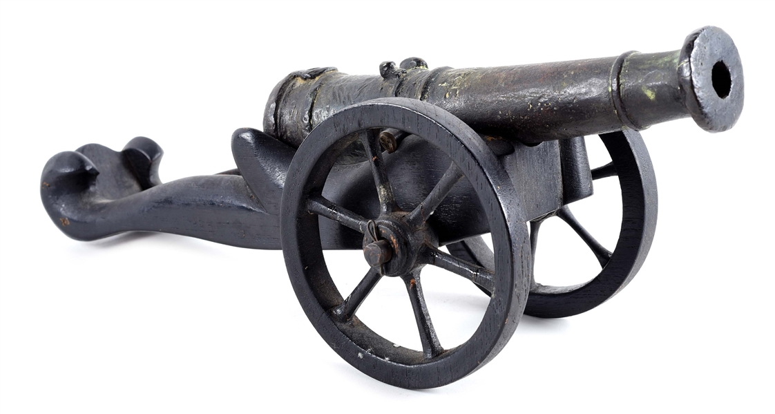 SMALL CAST BRONZE CANNON MODEL ON WOOD CARRIAGE. 