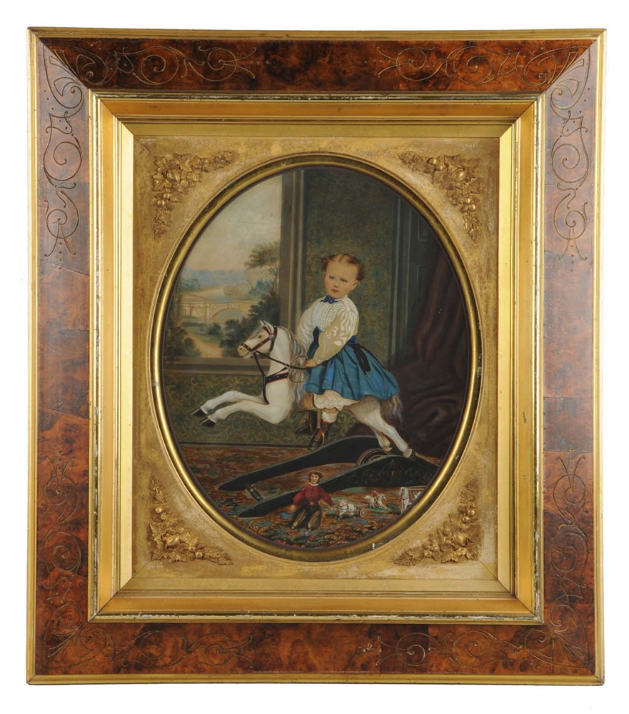 PORTRAIT OF YOUNG CHILD ON ROCKING HORSE.         