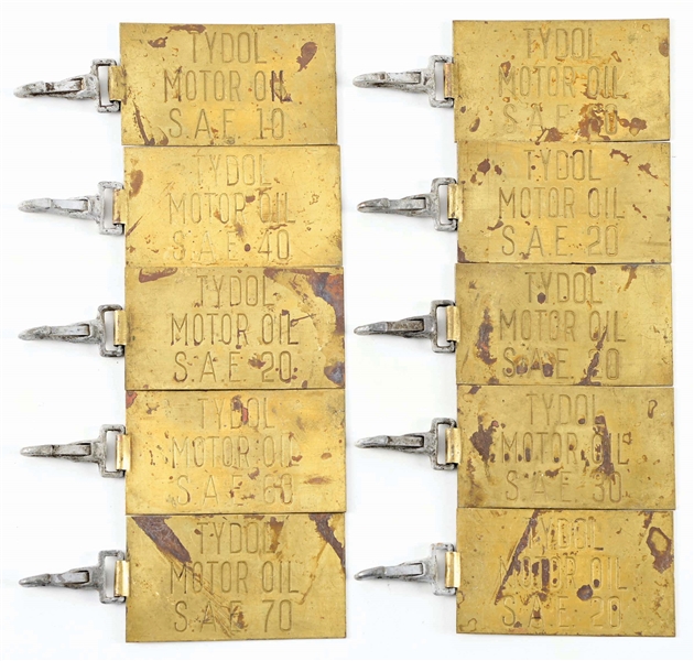 COLLECTION OF TEN TYDOL MOTOR OILS STAMPED BRASS LARGE OIL BARREL TAGS. 