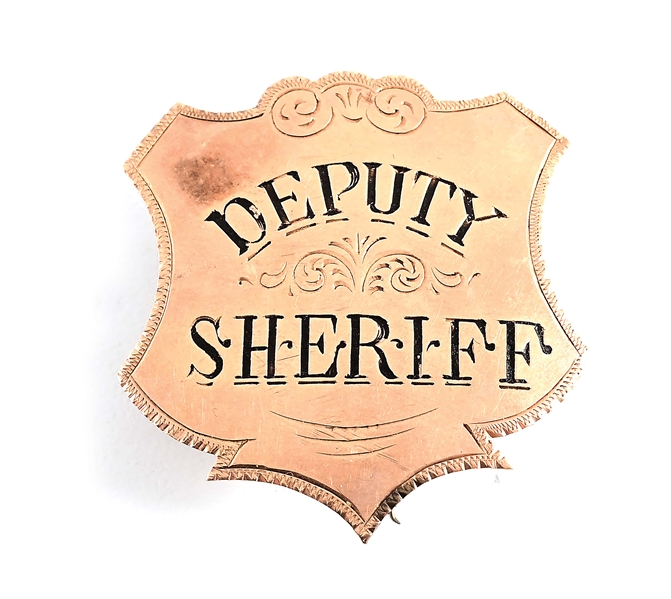 GOLD DEPUTY SHERIFF BADGE.