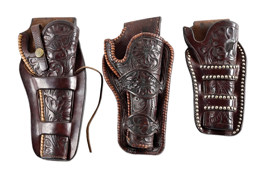 LOT OF 3: TOOLED ANTIQUE HEISER COWBOY HOLSTERS.