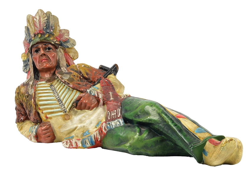 NATIVE AMERICAN RESTING ON GROUND STATUE.