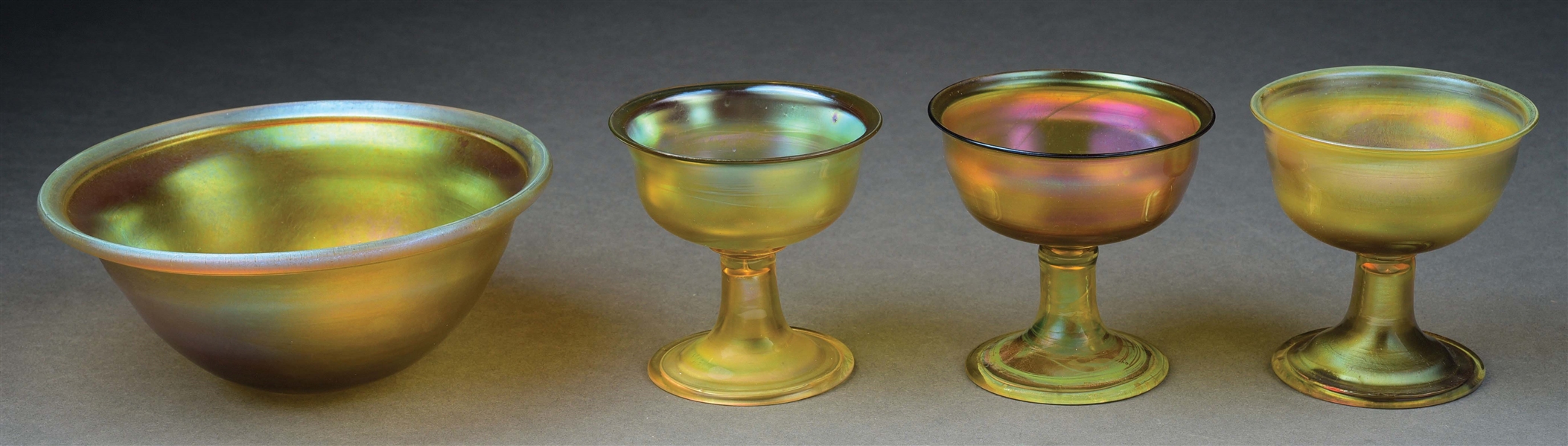 LOT OF 4: TIFFANY STUDIOS FAVRILE GLASS DESSERT BOWL SET.