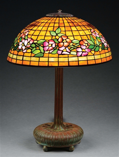 TIFFANY STUDIOS BELTED DOGWOOD LEADED GLASS TABLE LAMP.