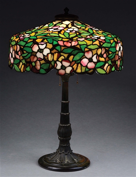 DUFFNER AND KIMBERLY DOGWOOD LEADED GLASS TABLE LAMP.