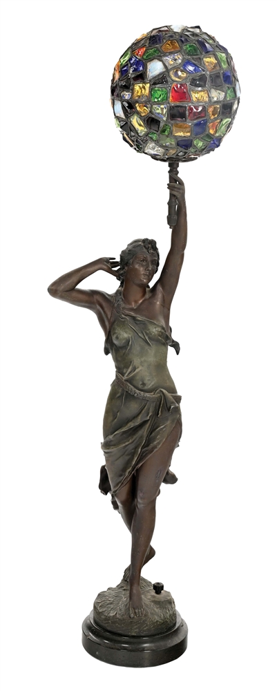 BRONZE LAMP OF WOMAN HOLDING STAINED CHUNK GLASS BALL SHADE.
