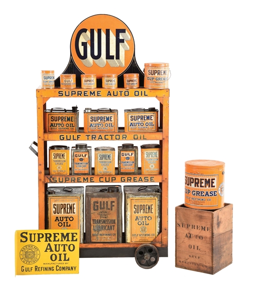 RARE COLLECTION OF GULF SUPREME AUTO OIL CANS WITH SERVICE STATION CART & FLANGE SIGN. 