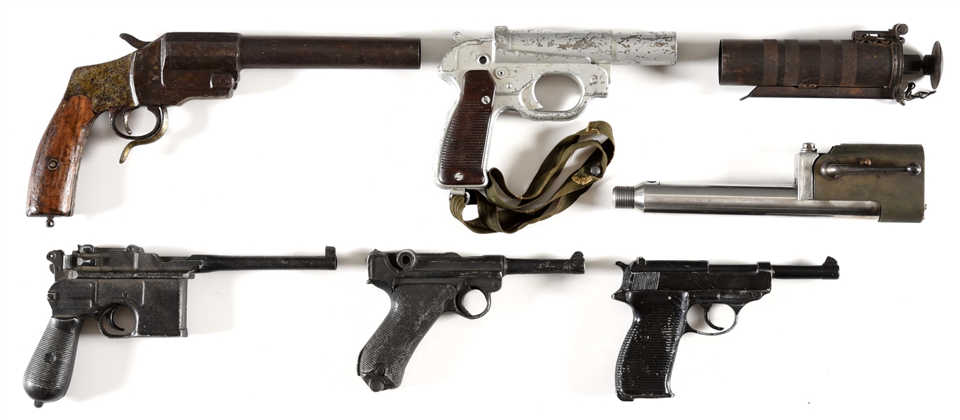 LOT OF 7: FLARE GUNS, HOLSTER MOLDS, AND CARTRIDGE ENGINE STARTER.