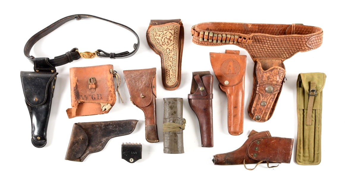 LARGE LOT OF MISCELLANEOUS HOLSTERS AND LEATHER GEAR.