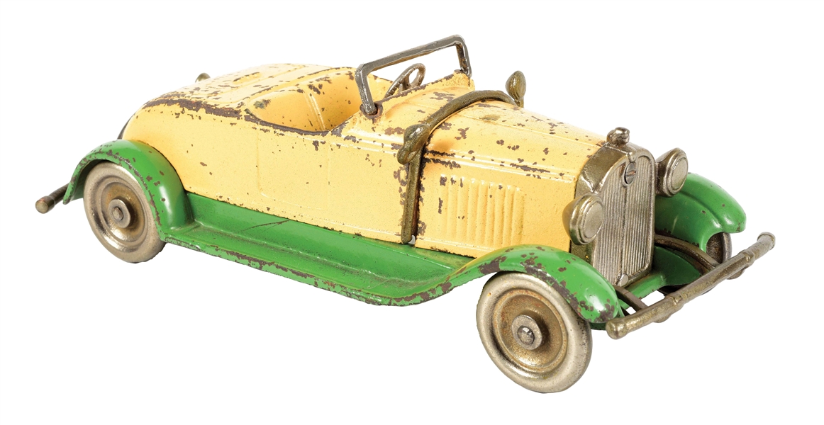 CAST IRON YELLOW AND GREEN TOWN CAR.