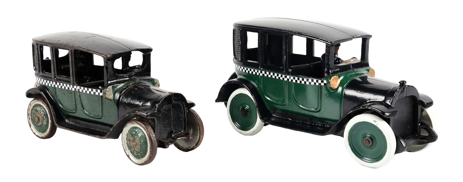 LOT OF 2: CAST IRON GREEN AND BLACK TAXI CAB CARS.