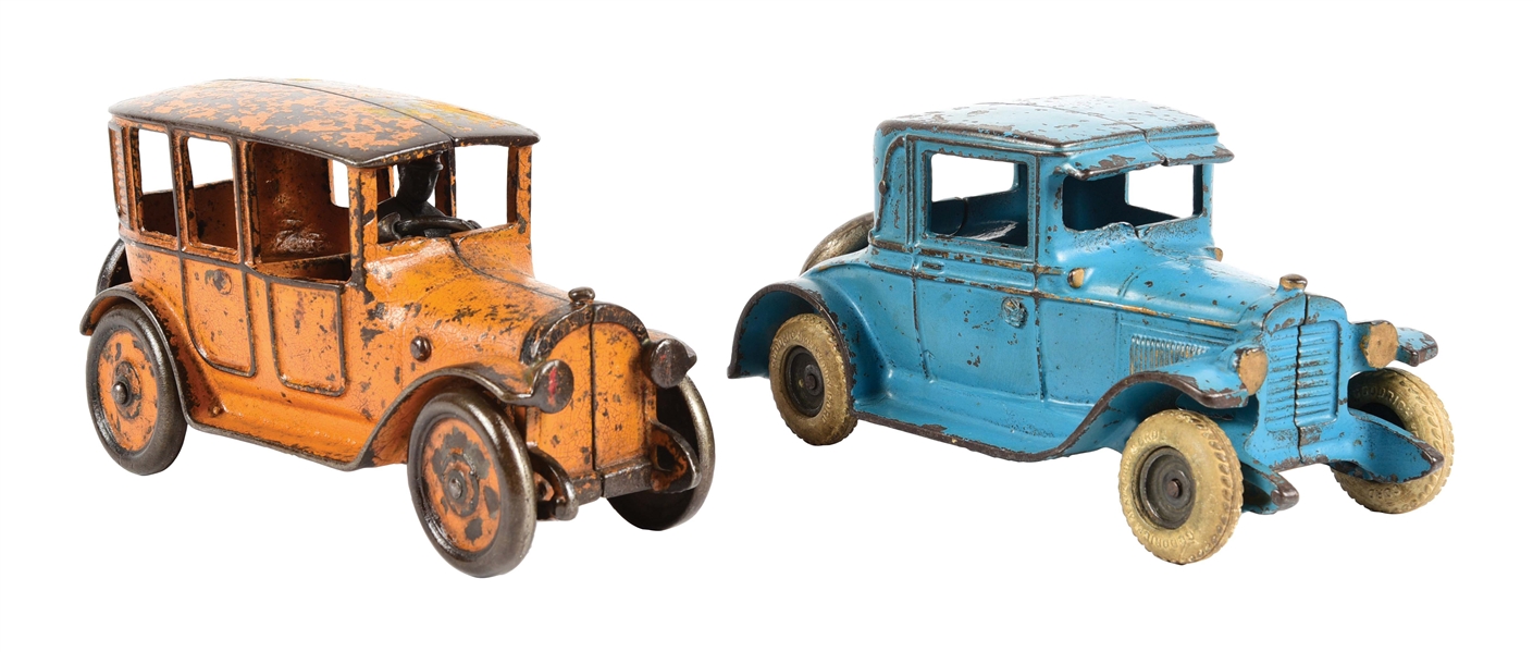 LOT OF 2: CAST IRON BLUE AND ORANGE TOWN CARS.