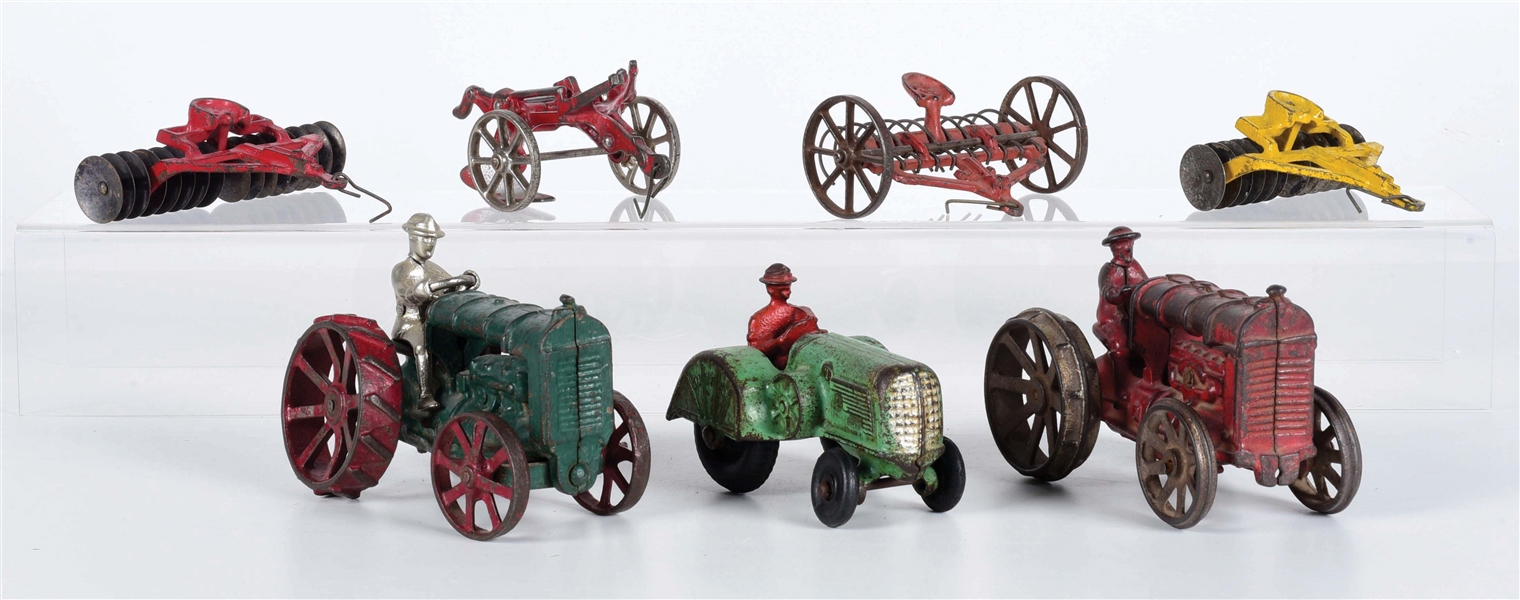 LOT OF 7: AMERICAN-MADE CAST IRON TRACTORS & ACCESSORIES.