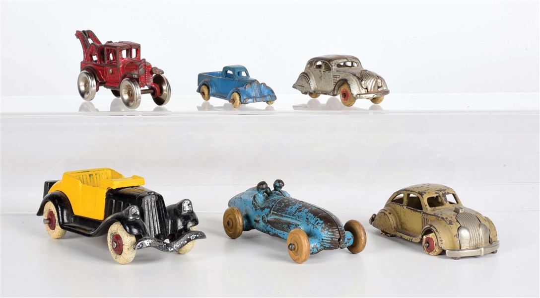 LOT OF 6: VARIOUS AMERICAN-MADE CAST IRON VEHICLES.