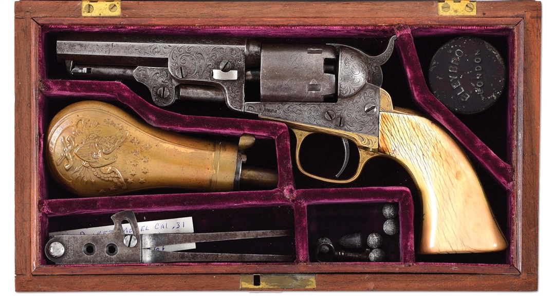 (A) CASED AND FACTORY ENGRAVED COLT MODEL 1849 POCKET REVOLVER.