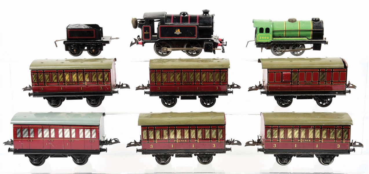 LOT OF 9: "O" GAUGE 2 HORNBY LOCOMOTIVES AND 6 PASSENGER CARS.