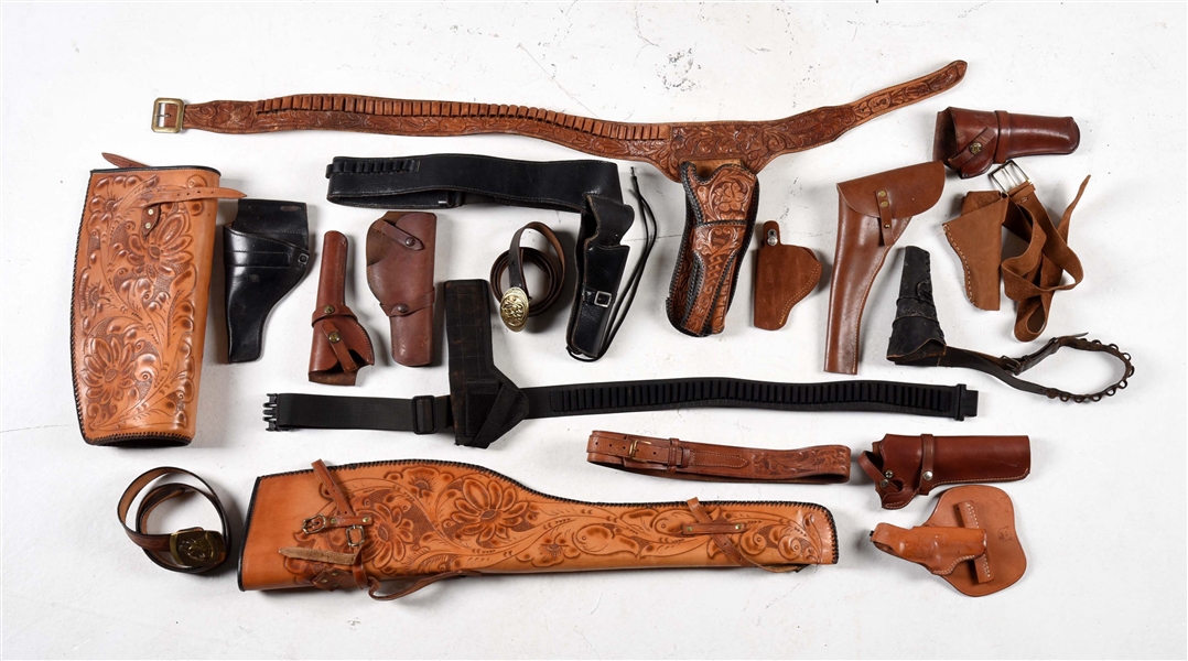 LARGE LOT OF HOLSTERS, BELTS AND RIFLE SCABBARD.