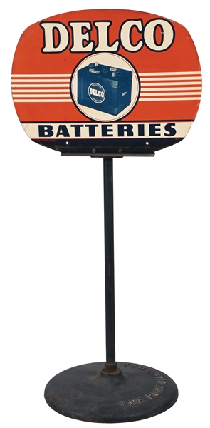 DELCO BATTERIES PAINTED METAL SIGN W/ EARLY BATTERY GRAPHIC.